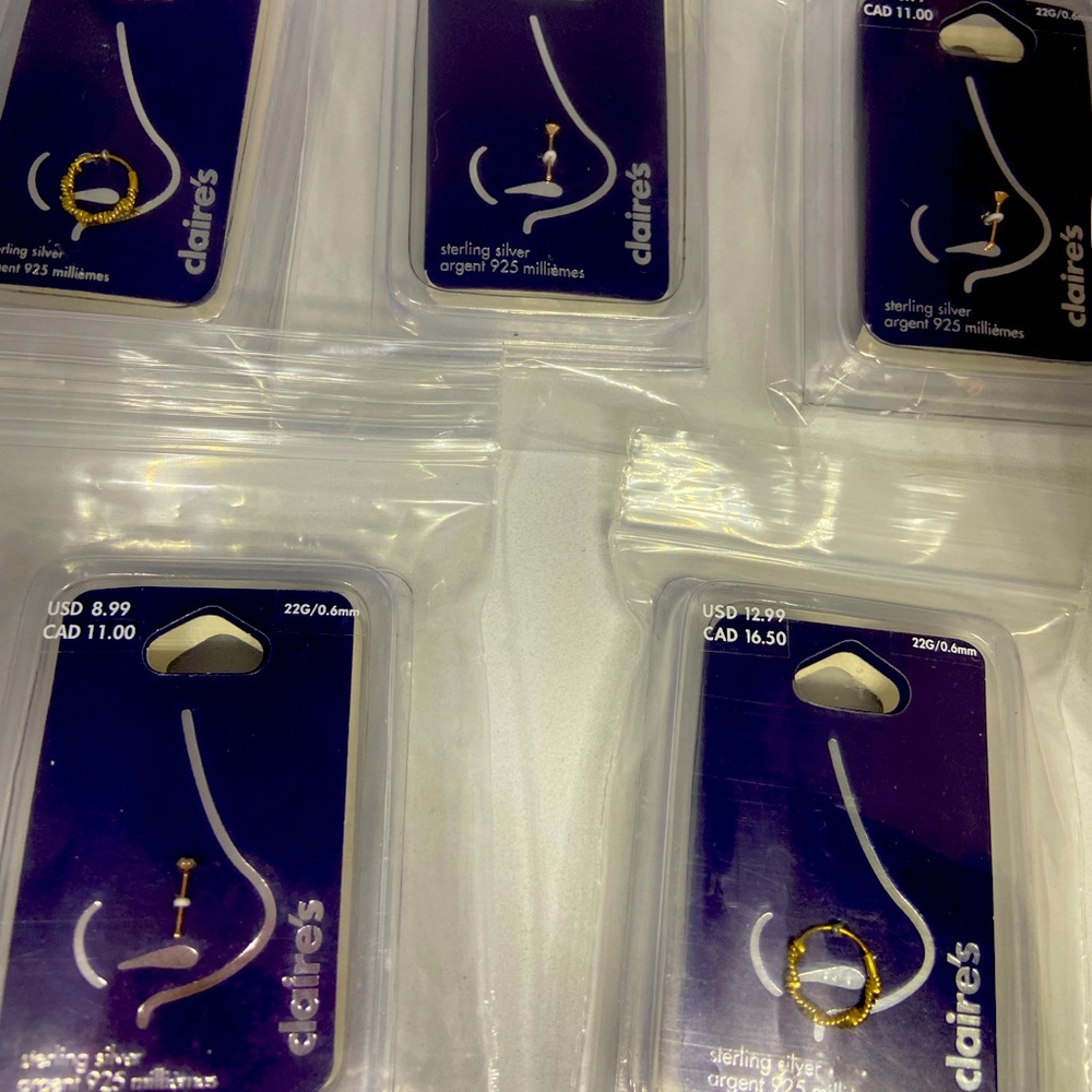 5 nose piercings all different and stainless steal all new in packaged